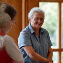 A community support worker assisting an elderly person